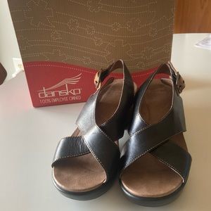 Dansko Jacinda Black slingback cross over sandals.  Black calf leather.